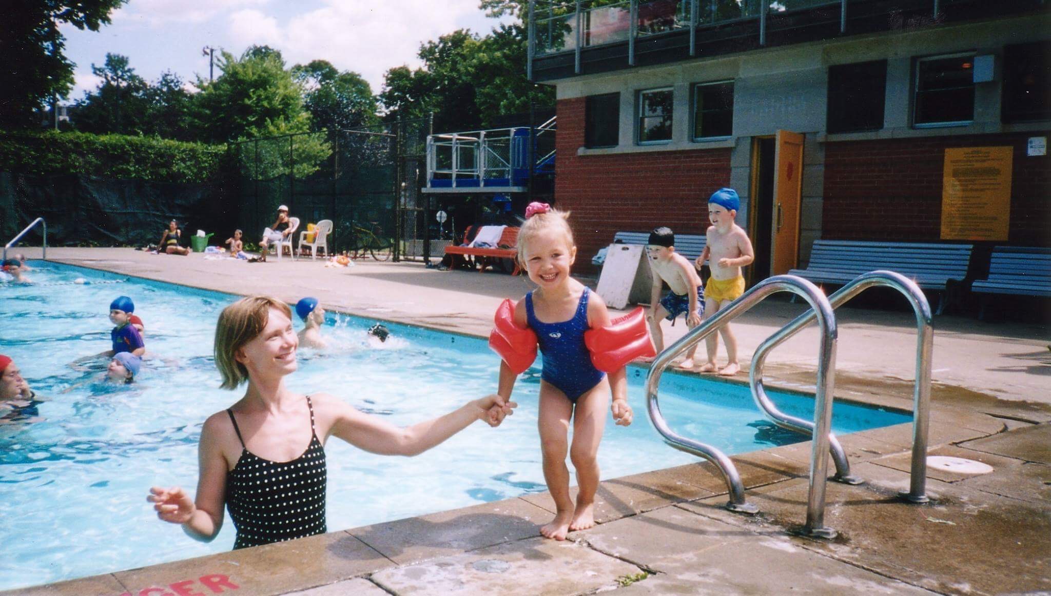 This is an old picture of my mother and I at the pool in 2003.